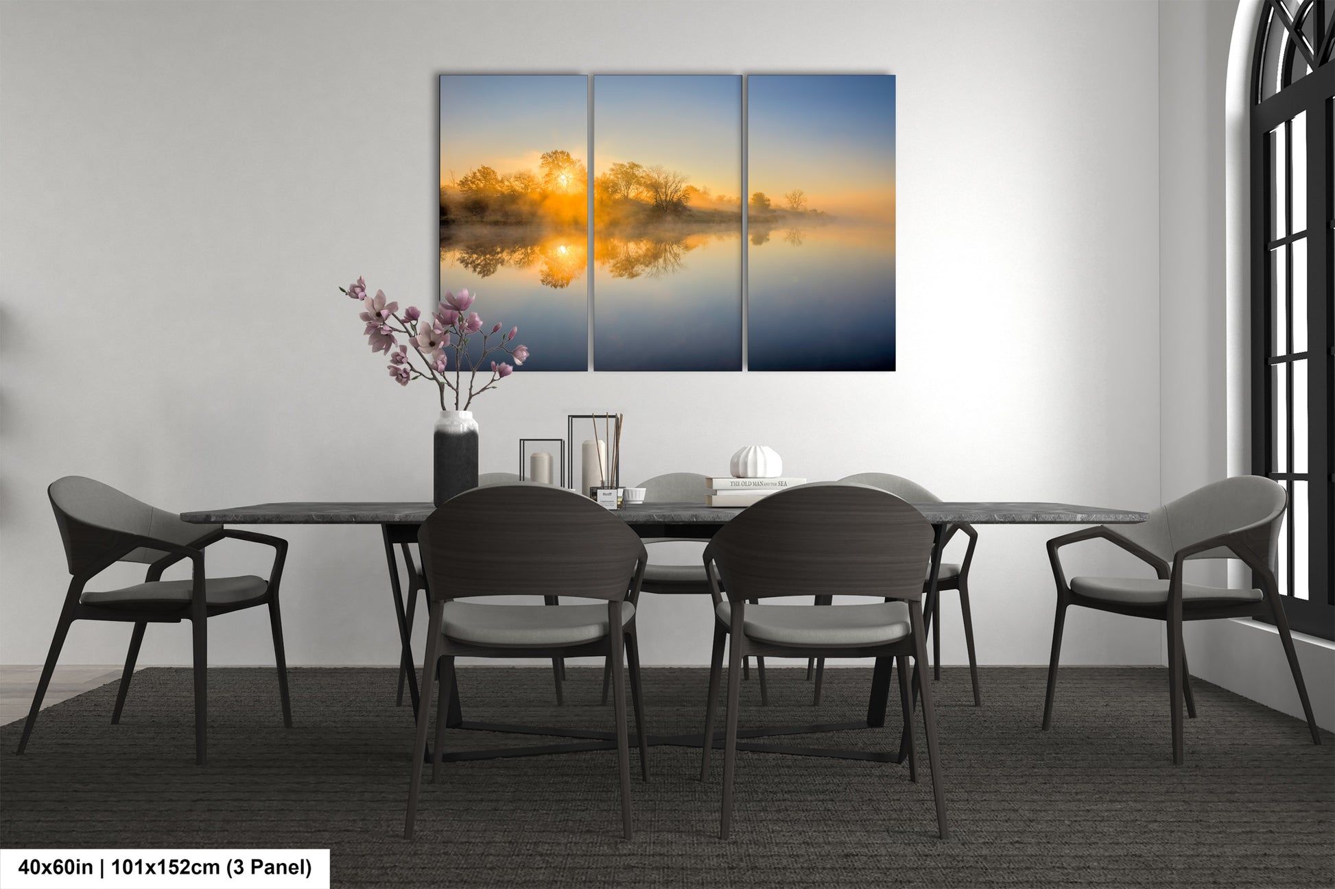 a dining room table with four chairs and a painting on the wall