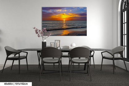a dining room table with chairs and a painting on the wall