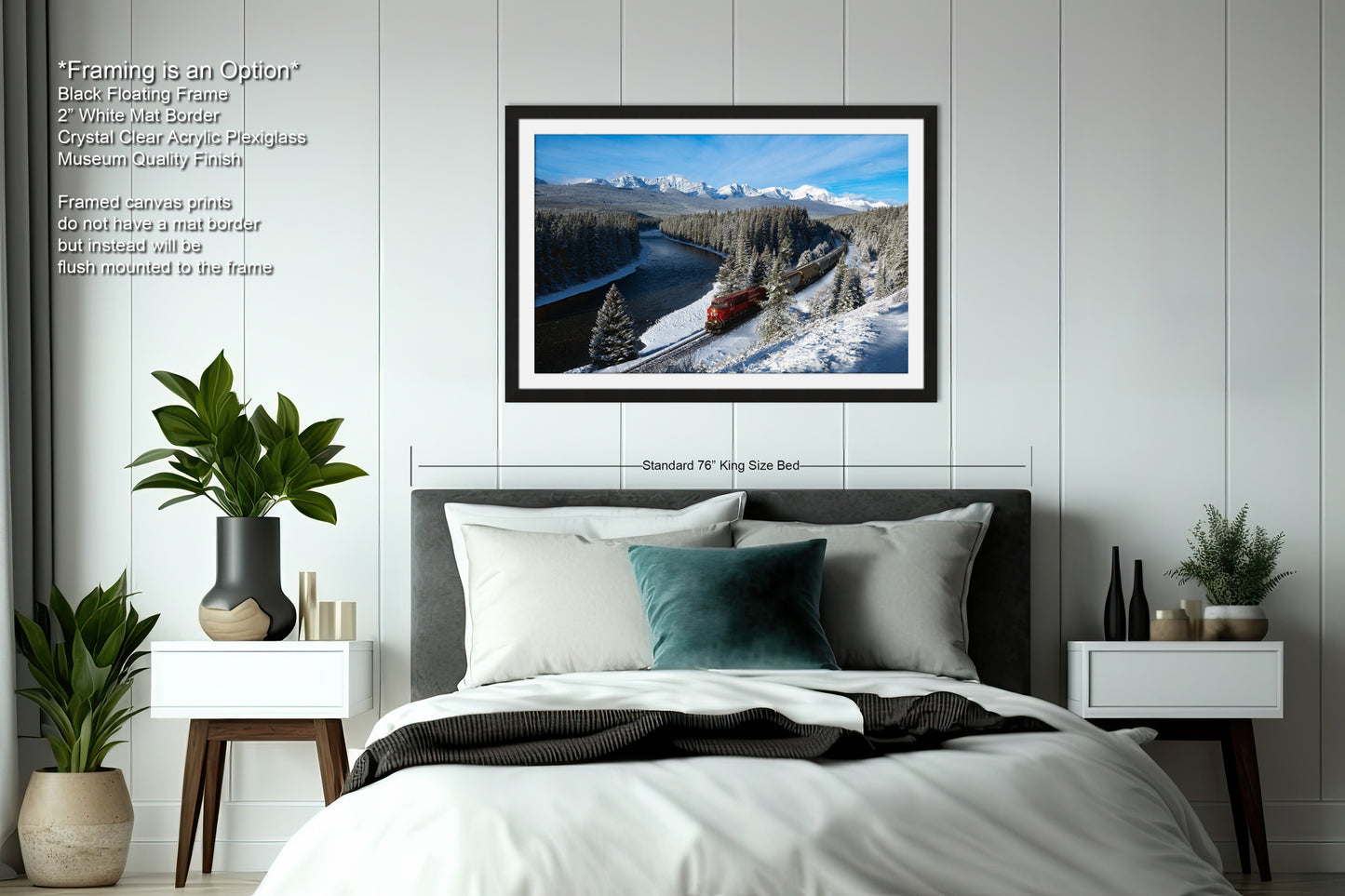 a bedroom with a large framed picture of a snowy mountain landscape hanging on the wall above a bed with white bedding.