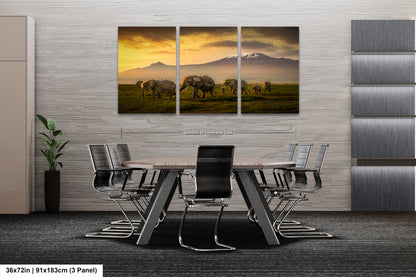 a dining room table with chairs and a painting on the wall