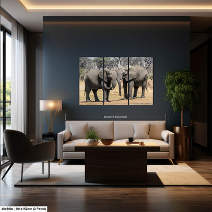 a living room filled with furniture and a painting of elephants