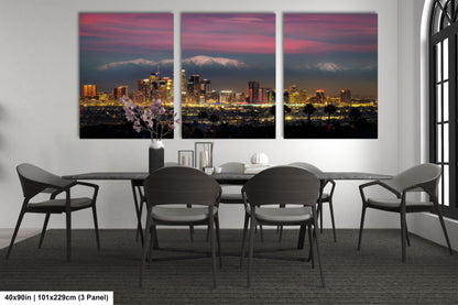 a dining room table with four chairs and a view of a city