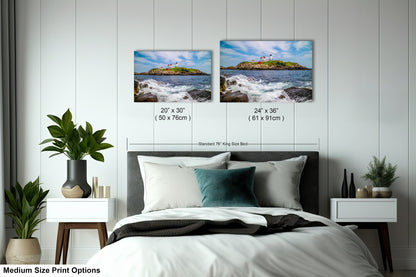 a bedroom with a bed and two pictures on the wall