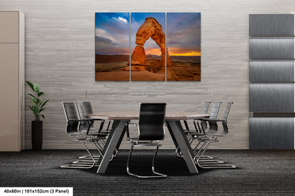 a dining room table with chairs and a large picture of a rock formation