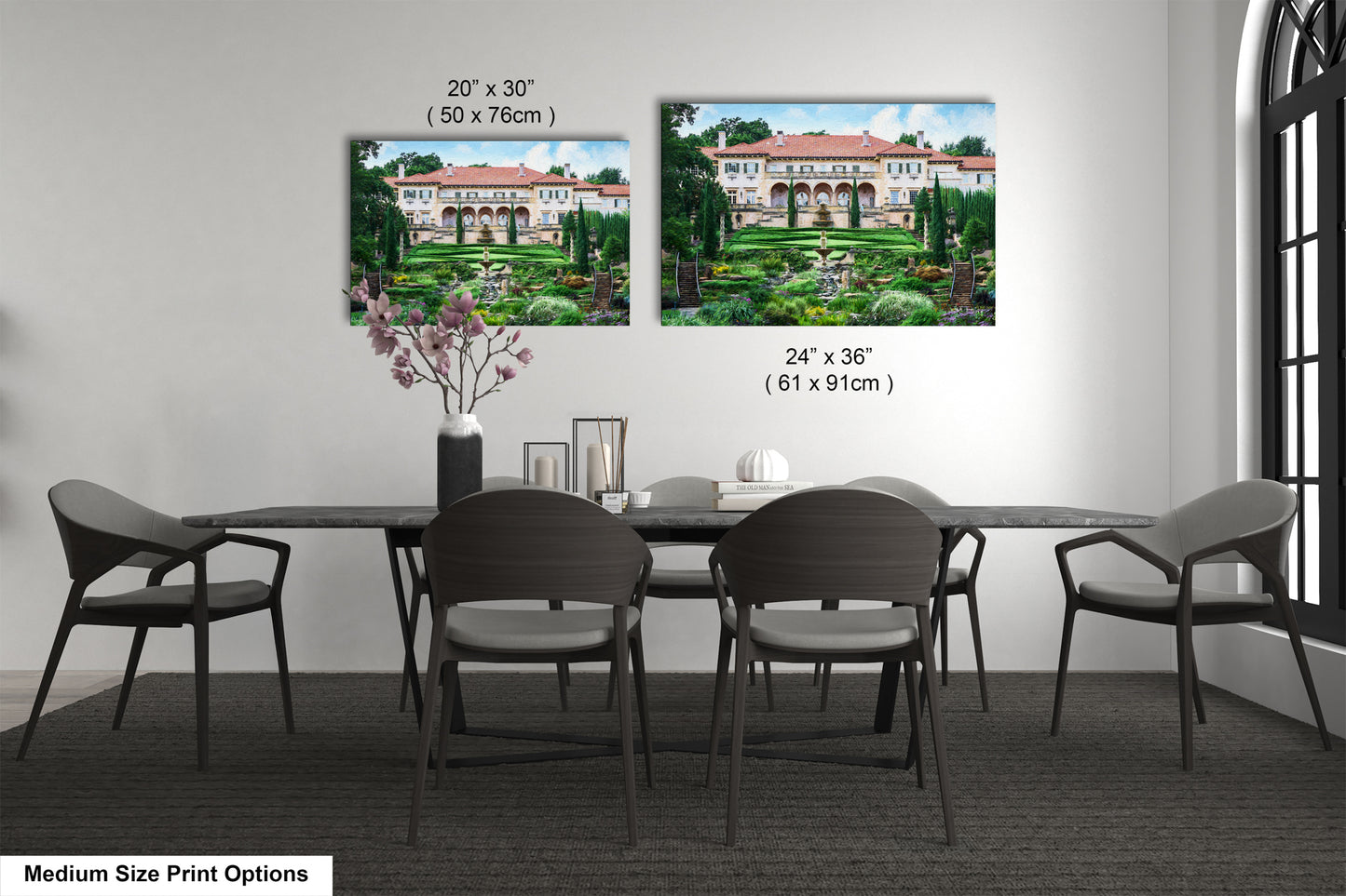 a dining room table with chairs and a vase of flowers