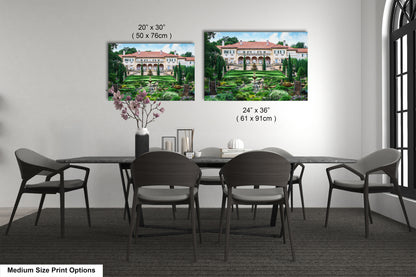 a dining room table with chairs and a vase of flowers
