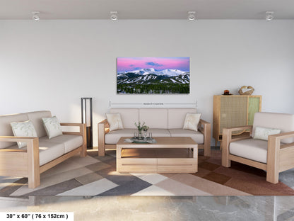 a living room filled with furniture and a painting on the wall