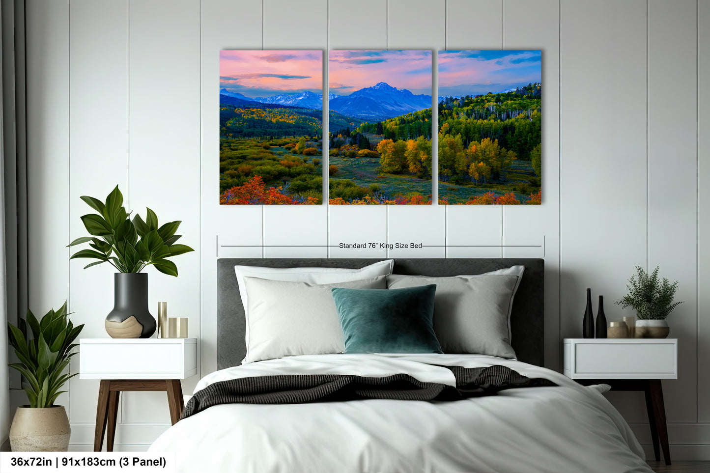 a bedroom with a bed and two paintings on the wall