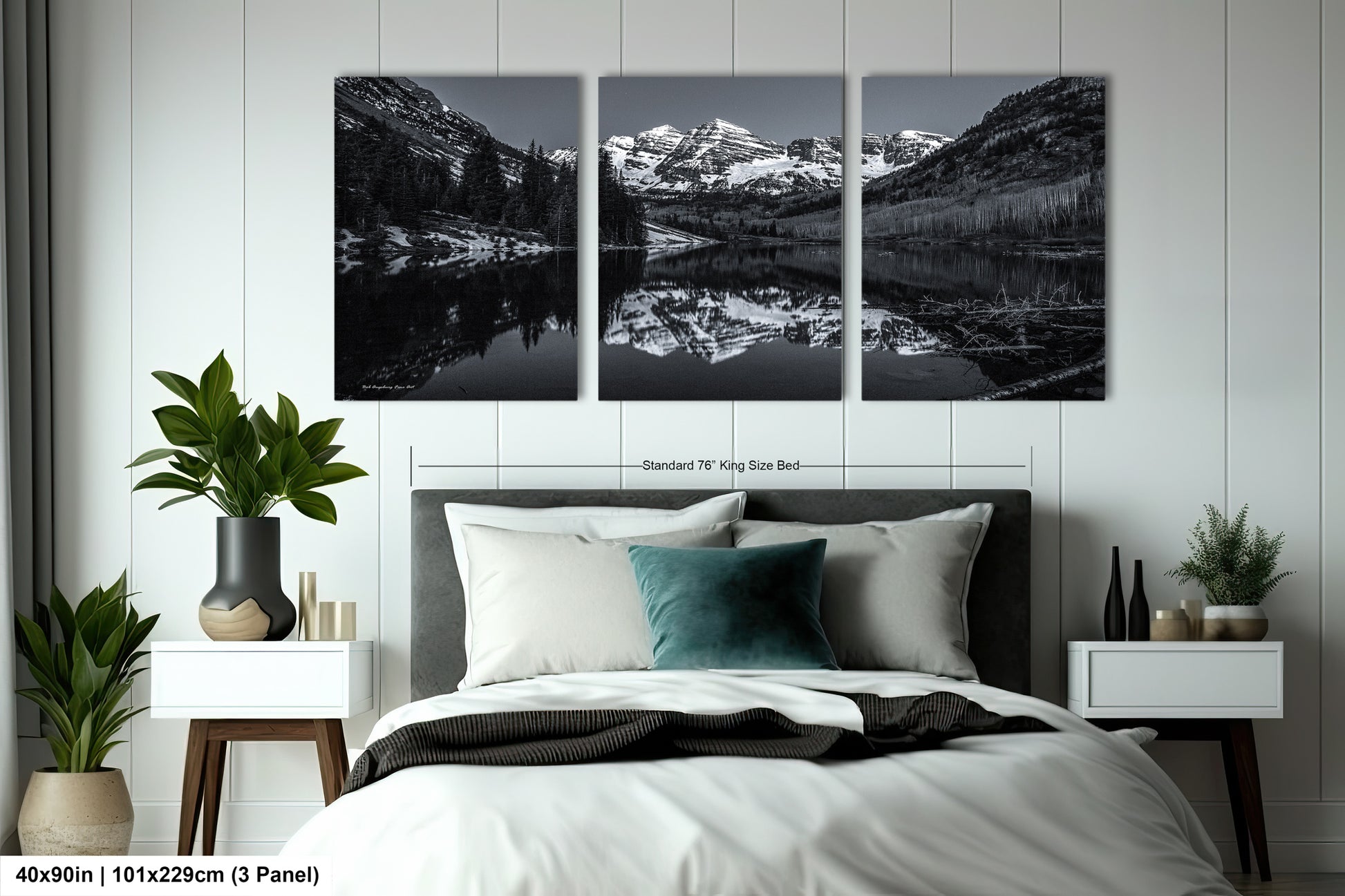 a black and white photo of a bedroom with mountains in the background
