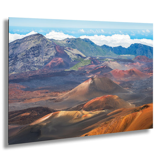 a breathtaking view of a mountainous landscape, with a variety of terrains including mountains, valleys, and rocky outcroppings. The colors in the image are vibrant and varied, showcasing the natural beauty of the scene.