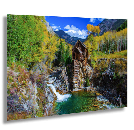 a painting of a waterfall and a cabin