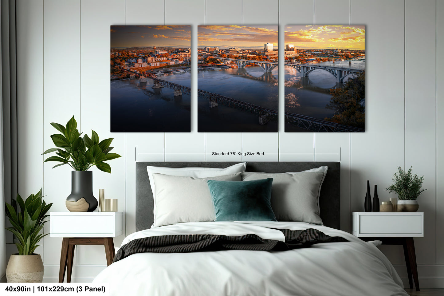 a bedroom with a bed and two paintings on the wall
