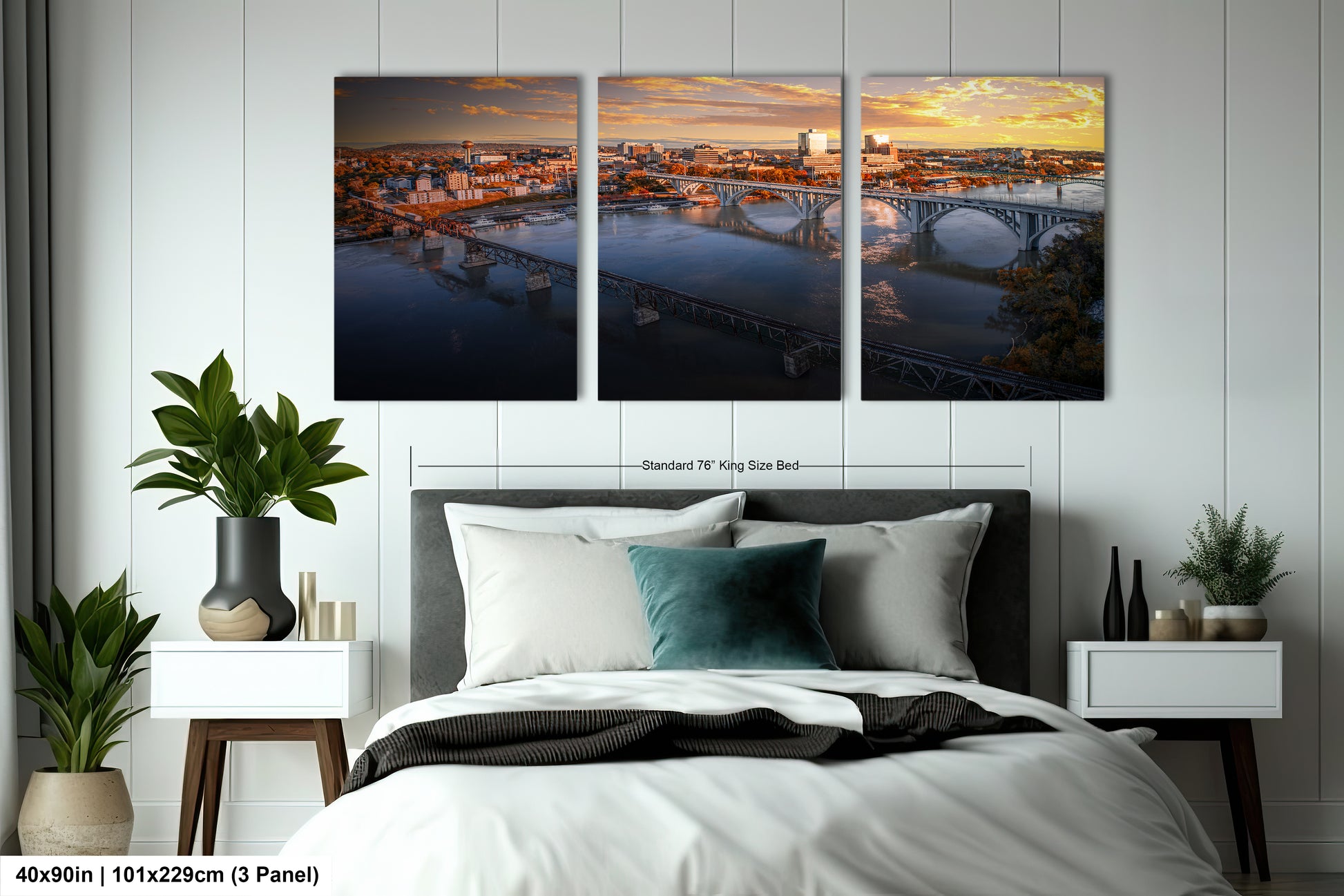 a bedroom with a bed and two paintings on the wall