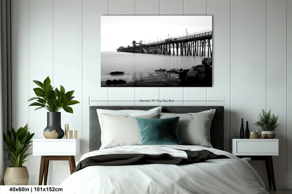 a black and white photo of a bedroom with a bed