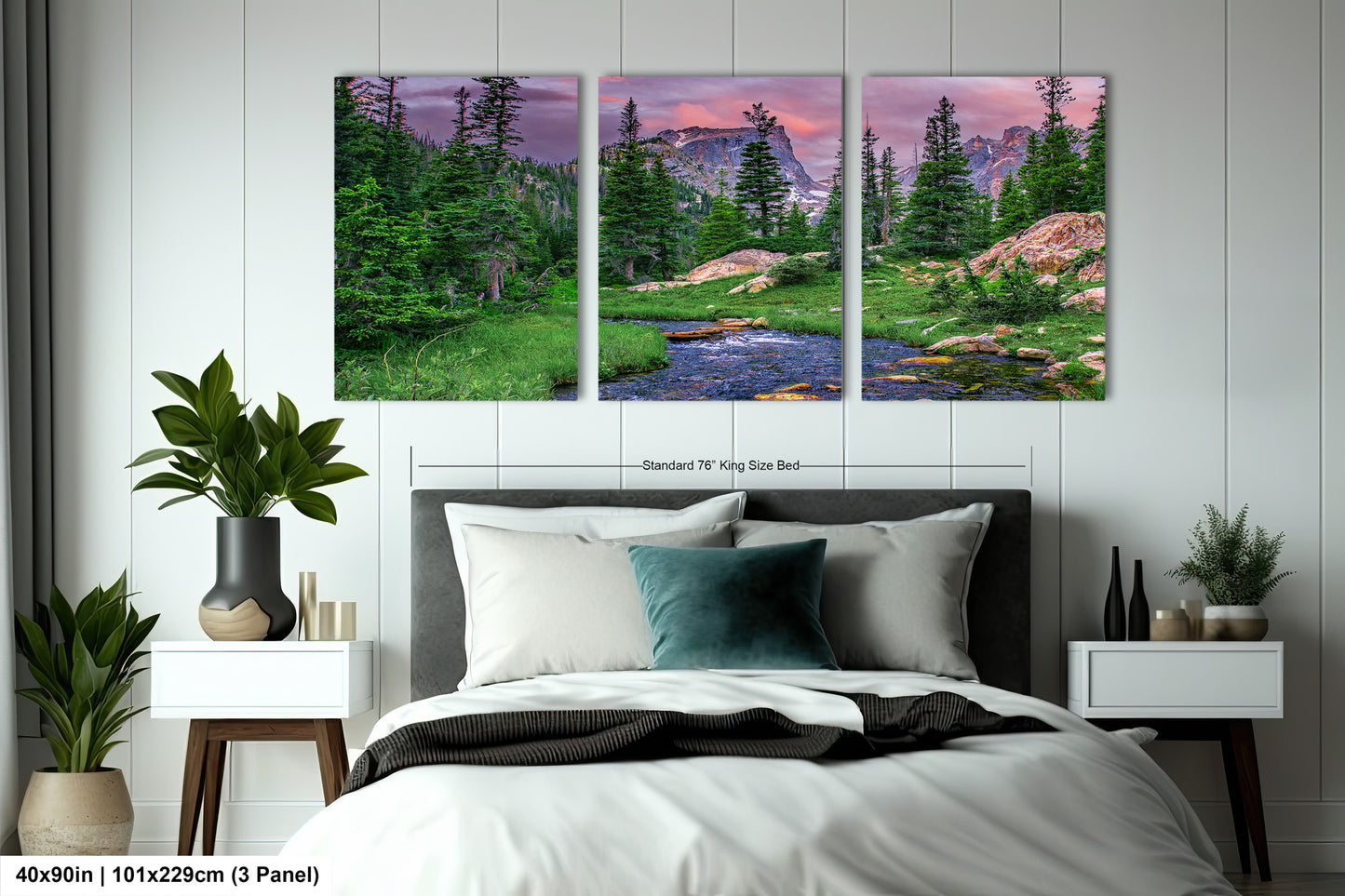 a bedroom with a bed and two paintings on the wall