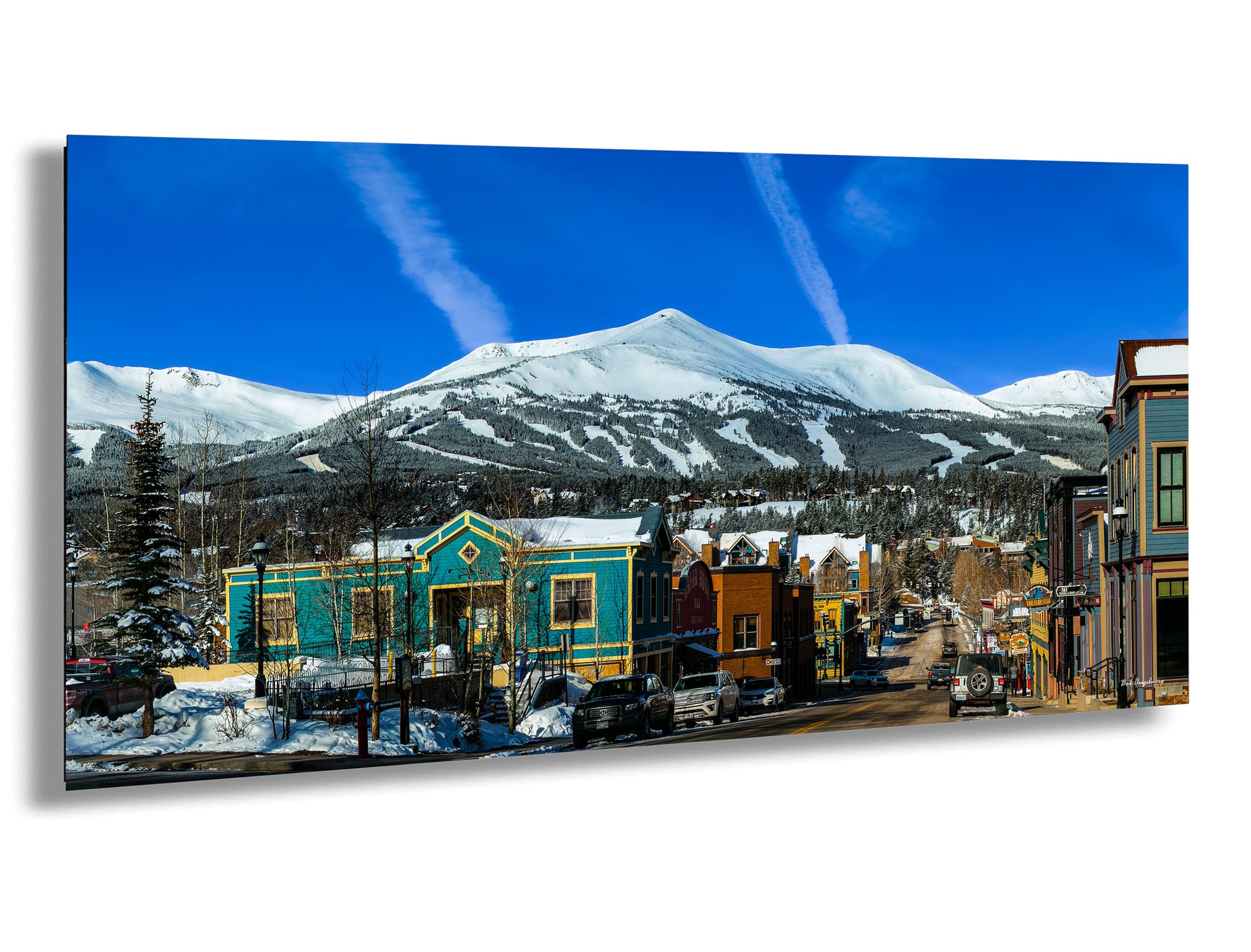 a picture of a town with a mountain in the background