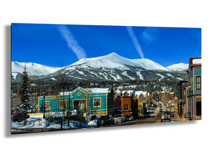 a picture of a town with a mountain in the background