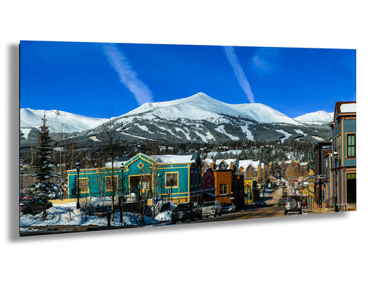 a picture of a town with a mountain in the background