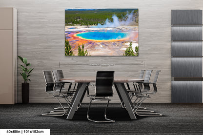 a dining room table with chairs and a painting on the wall