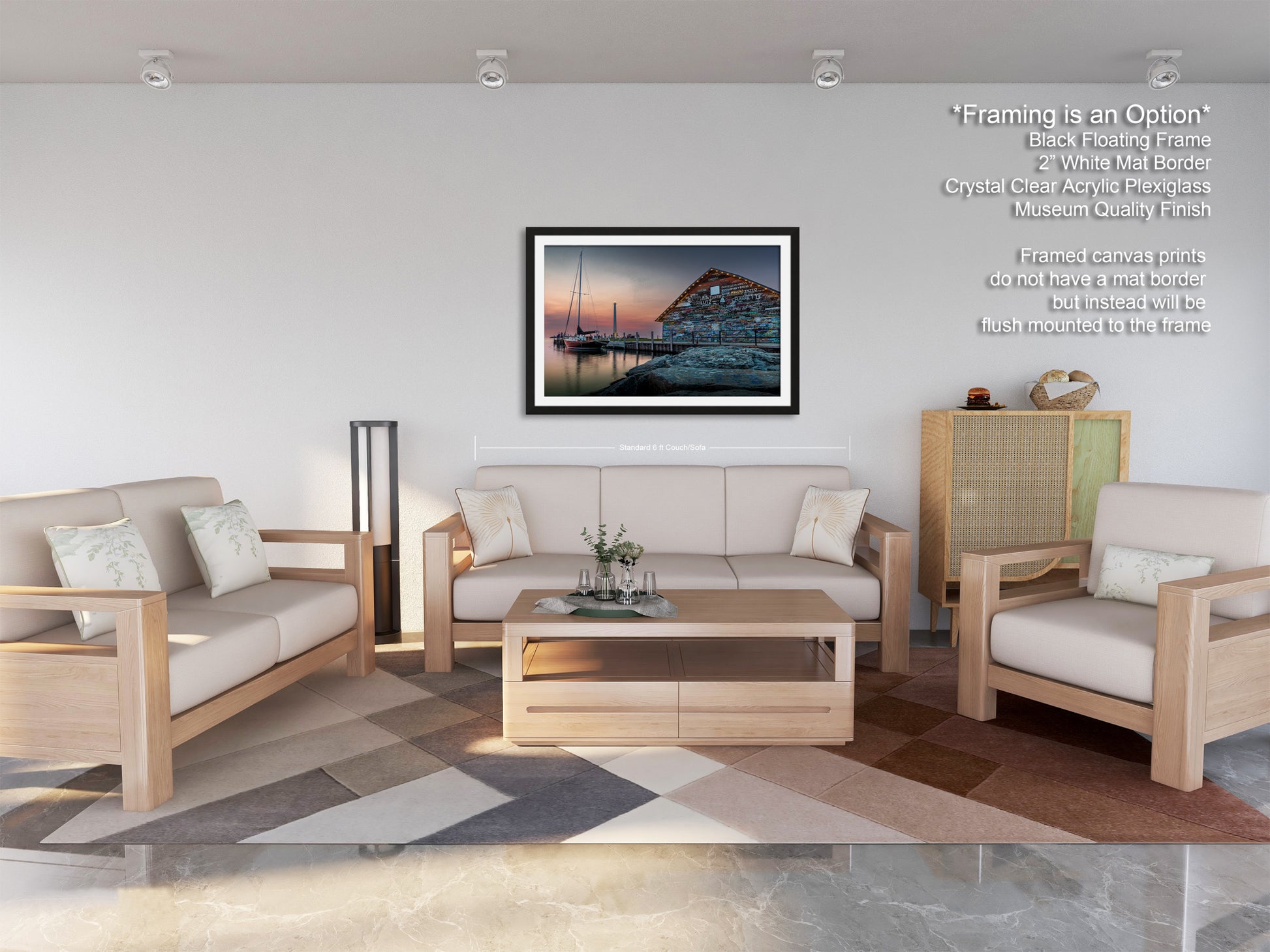 a modern living room with a large framed picture of a seascape hanging on the wall. The room is furnished with a sofa, two armchairs, and a coffee table, creating a comfortable and inviting atmosphere.