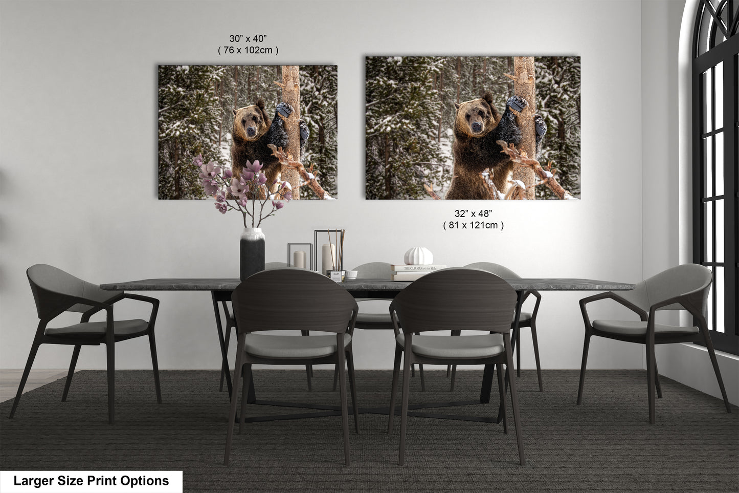 a dining room table with four chairs and two pictures of a dog