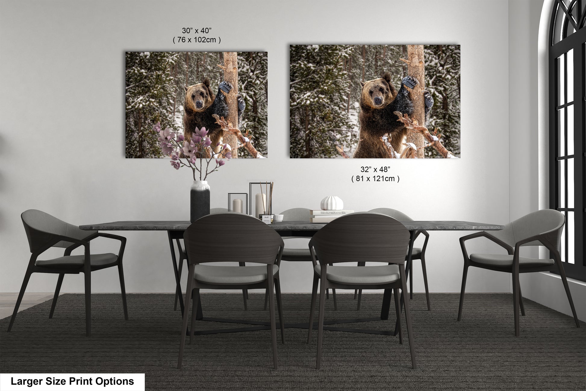 a dining room table with four chairs and two pictures of a dog