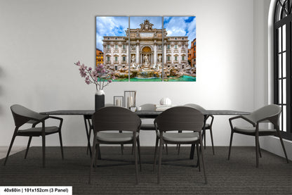 a dining room table with chairs and a painting on the wall
