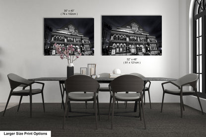 a black and white photo of a dining room