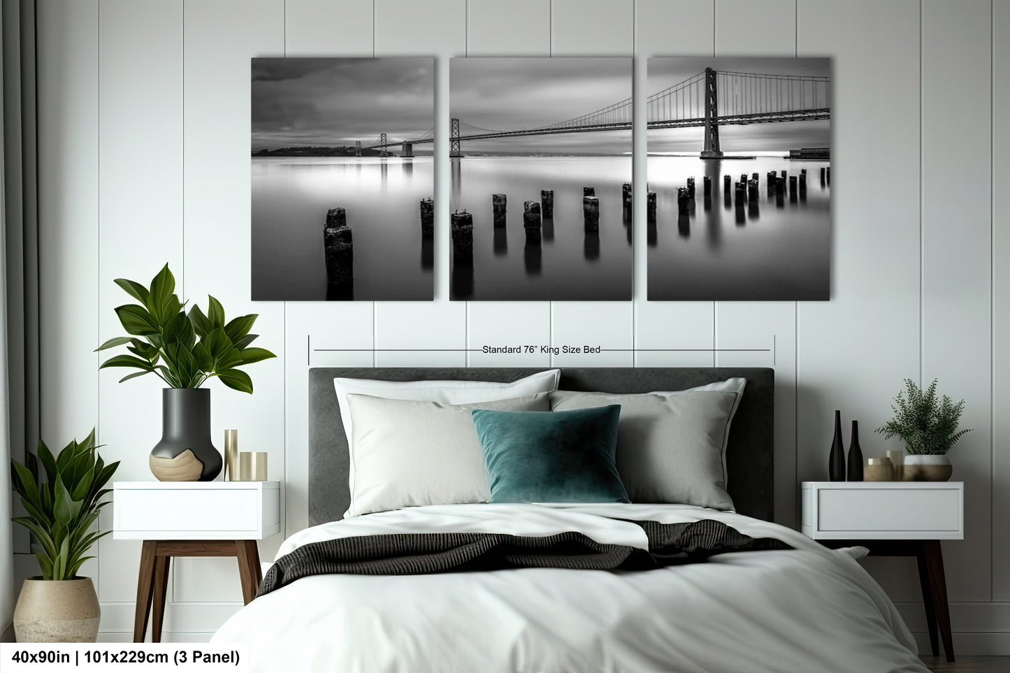 a black and white photo of a bed with a bridge in the background