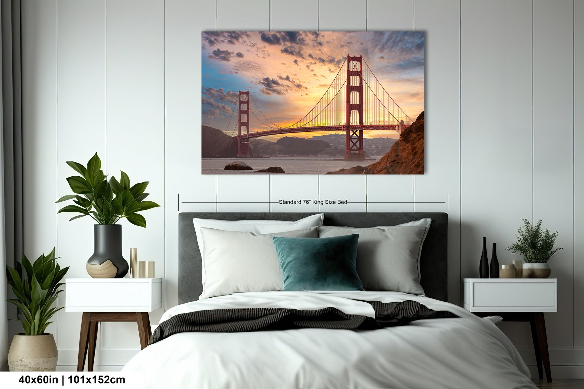 a bedroom with a bed and a picture of the golden gate bridge