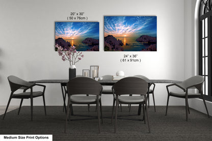 a dining table with four chairs and a vase of flowers