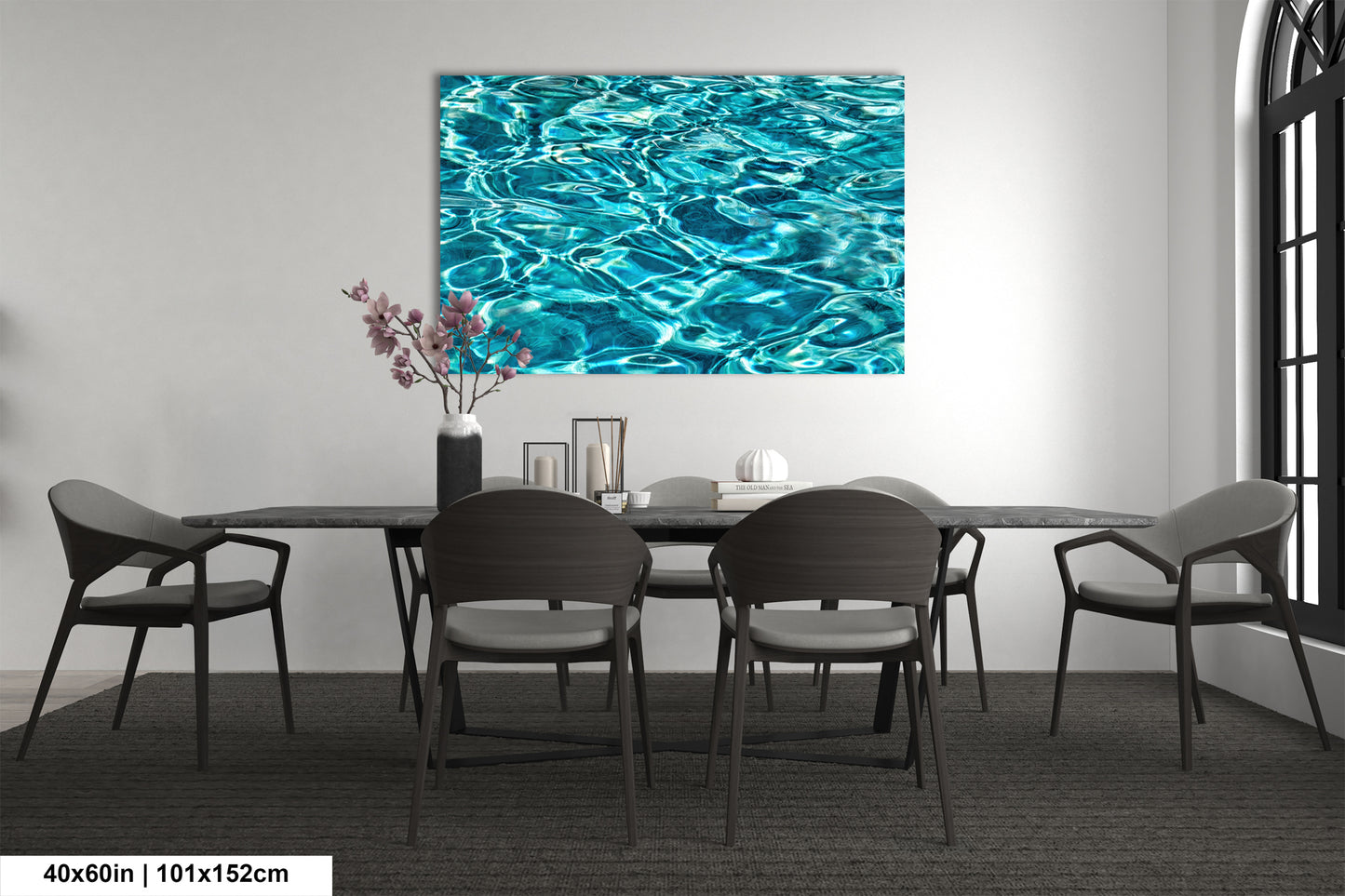 a modern dining room with a large blue watercolor painting hanging on the wall above a black table surrounded by six chairs.