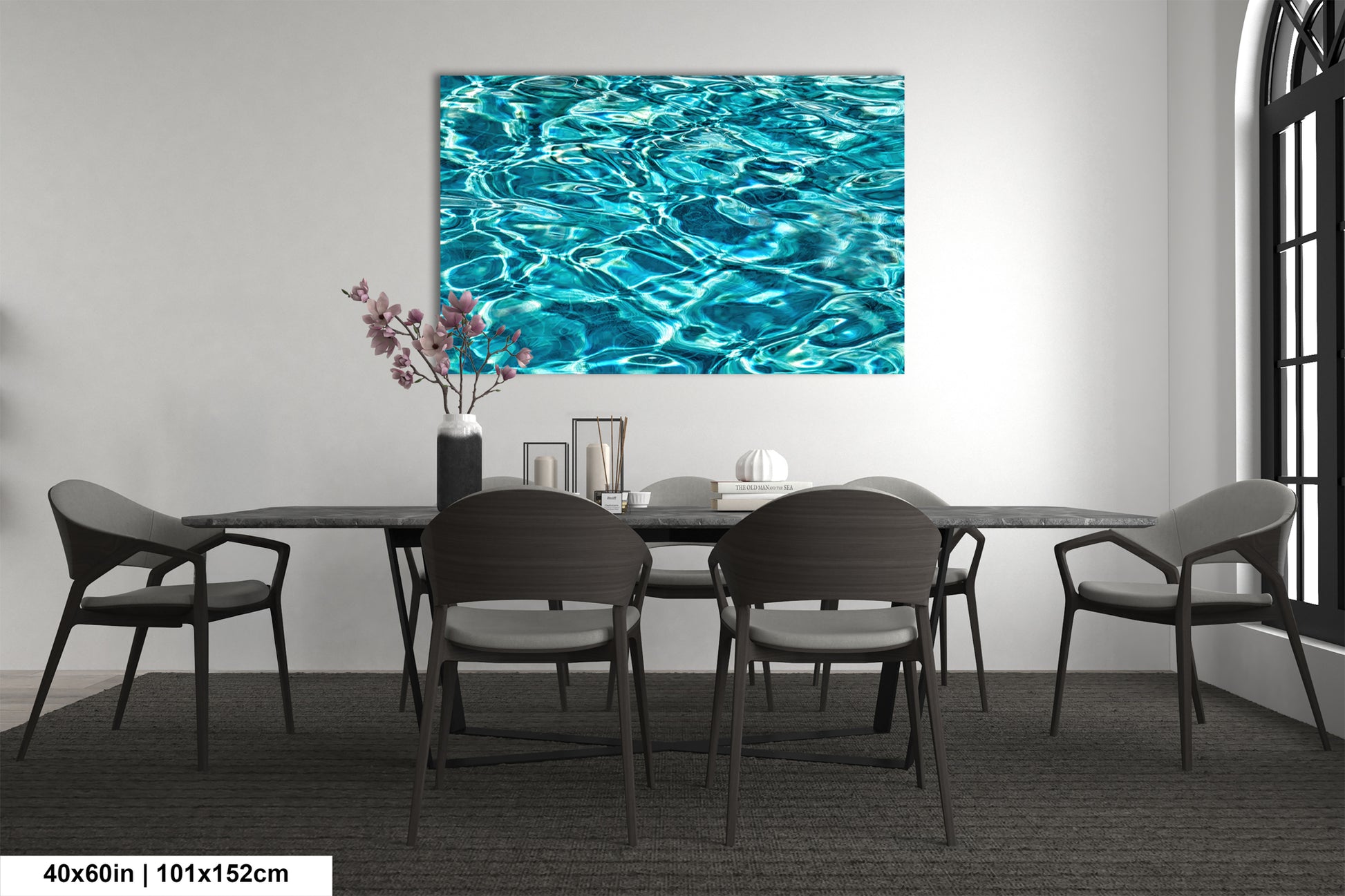 a modern dining room with a large blue watercolor painting hanging on the wall above a black table surrounded by six chairs.