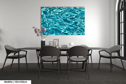 a modern dining room with a large blue watercolor painting hanging on the wall above a black table surrounded by six chairs.