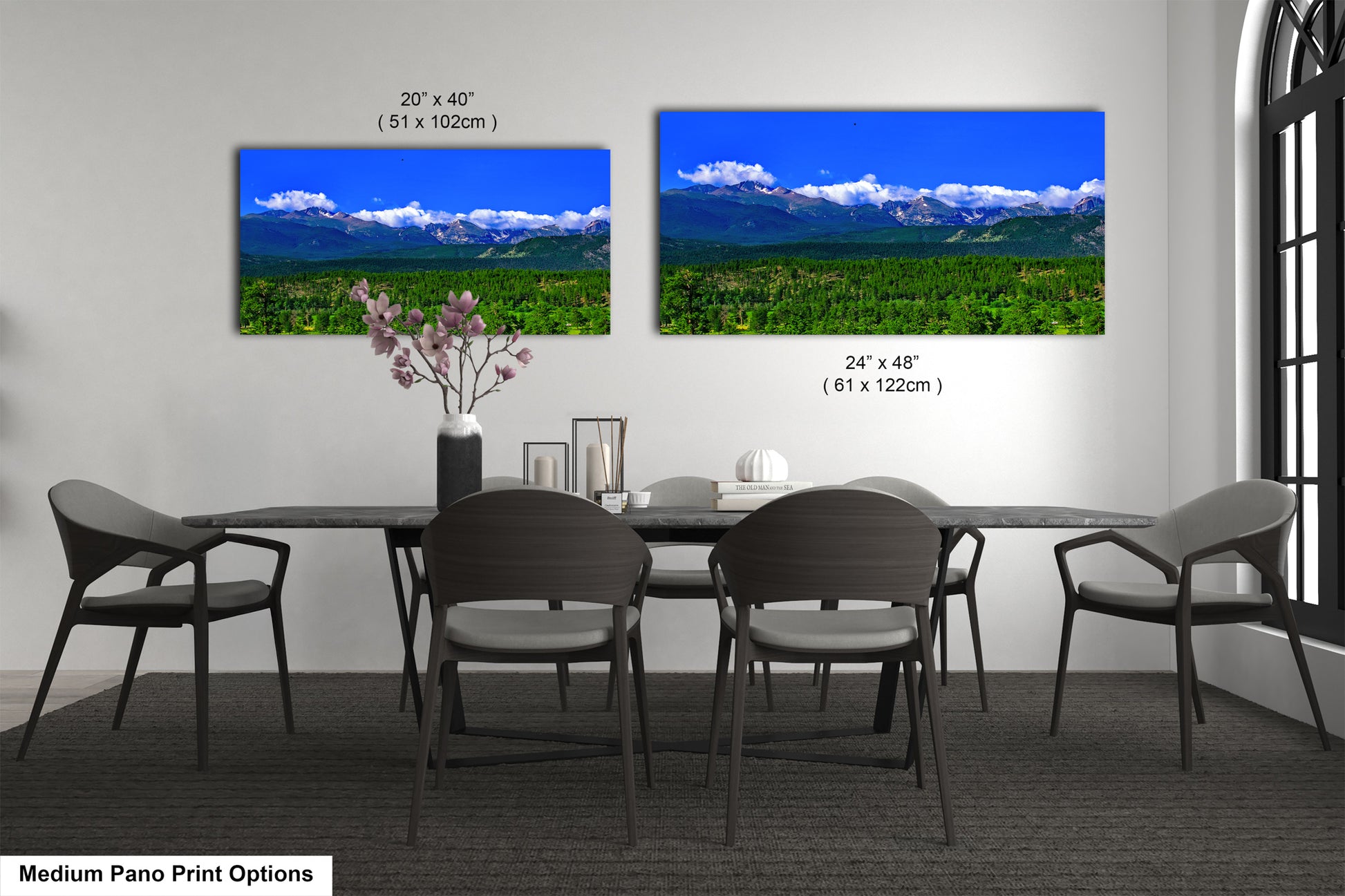 a dining room table with four chairs and a vase of flowers