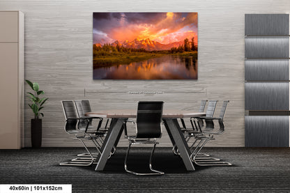 a dining room table with chairs and a painting on the wall