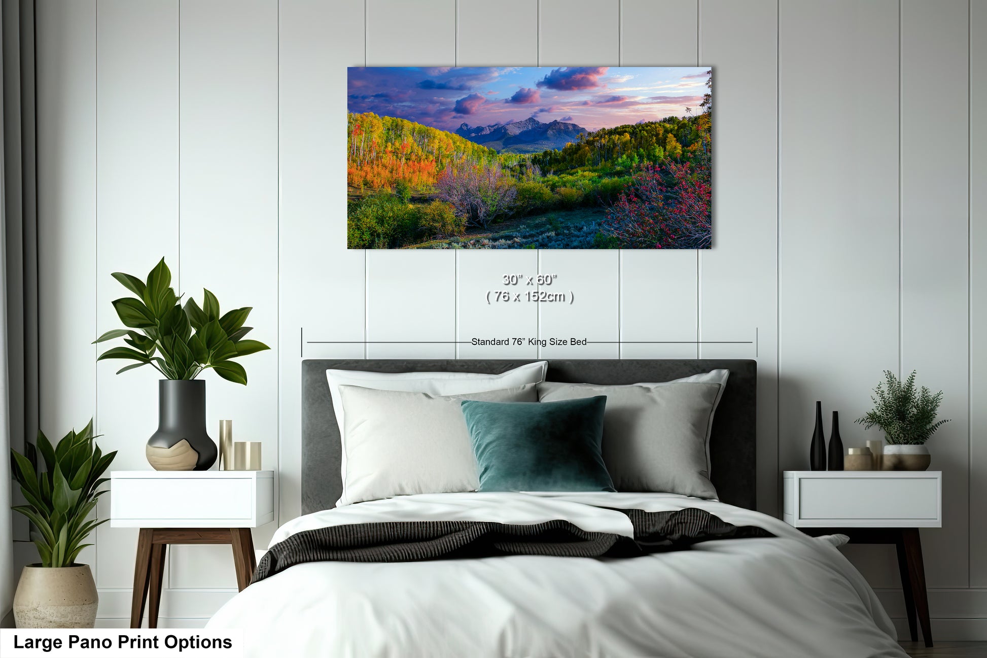 a bedroom with a bed and a painting on the wall