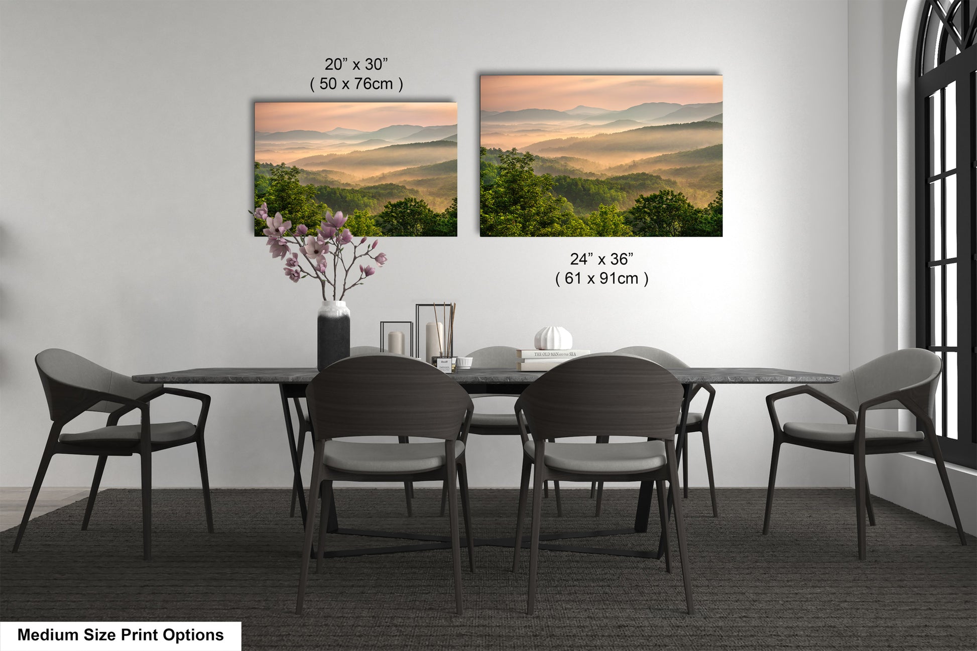 a dining table with four chairs and a vase with flowers