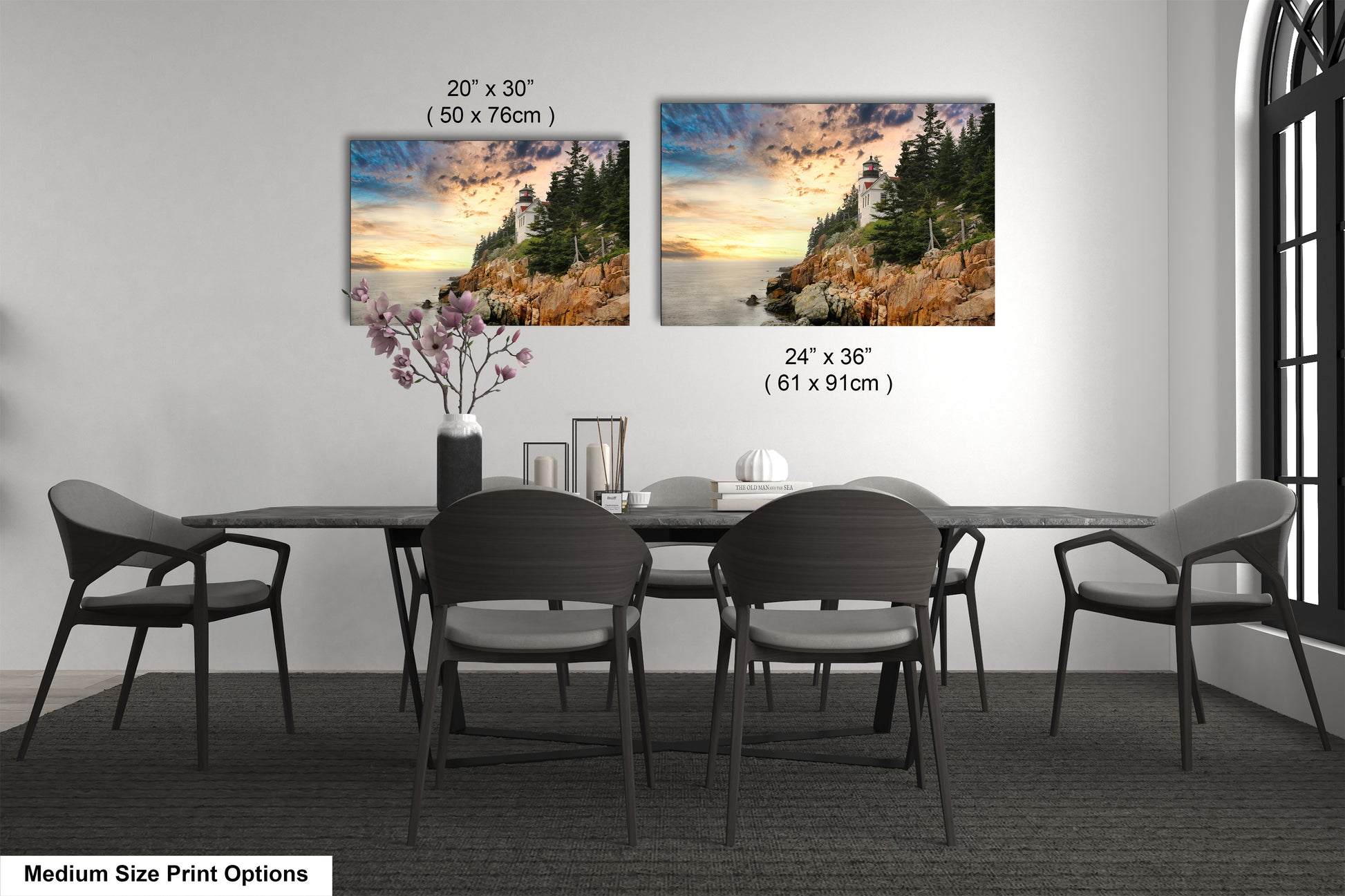a dining room table with four chairs and a vase of flowers