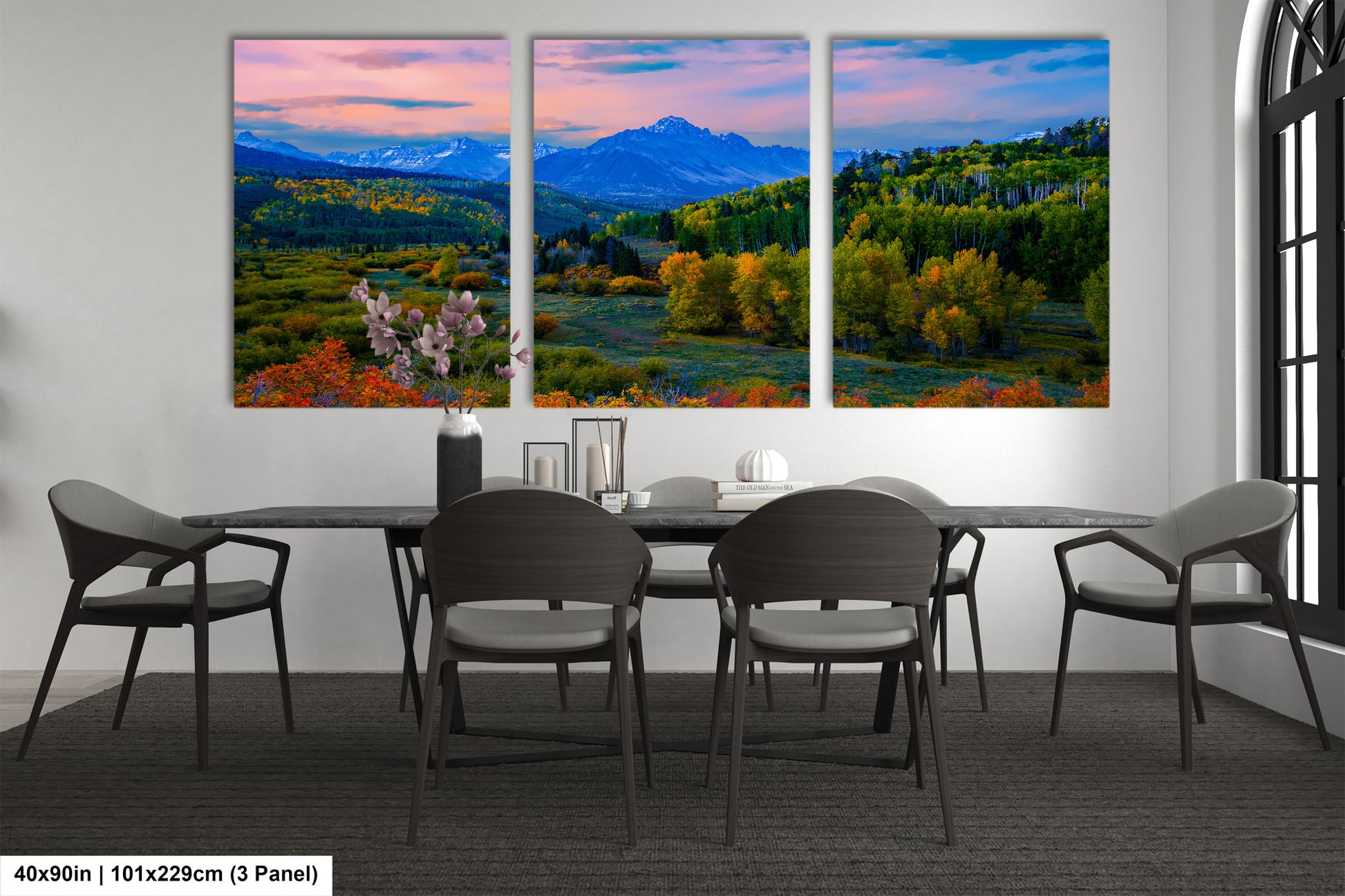 a dining room with a table and four chairs