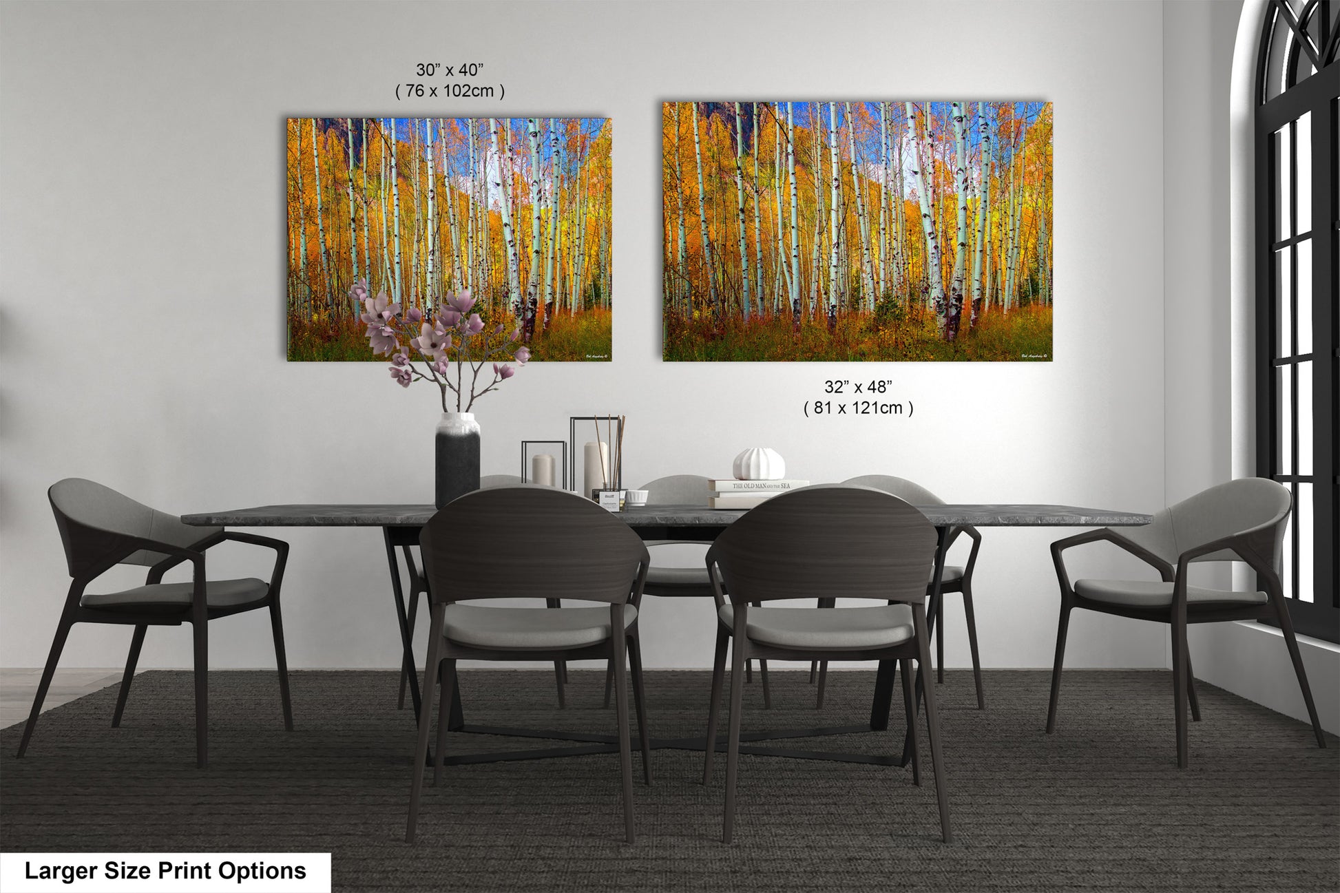 a dining room table with four chairs and a painting on the wall