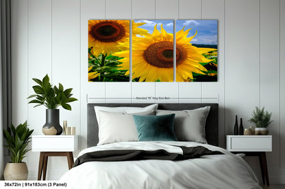 a bedroom with a bed and two sunflowers on the wall