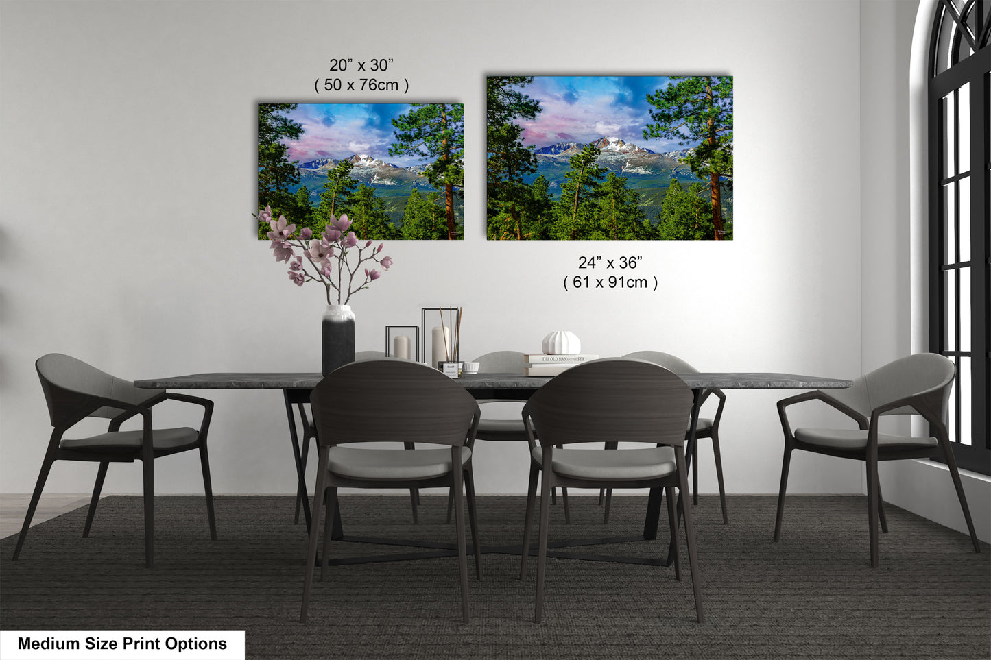 a dining table with four chairs and a vase of flowers