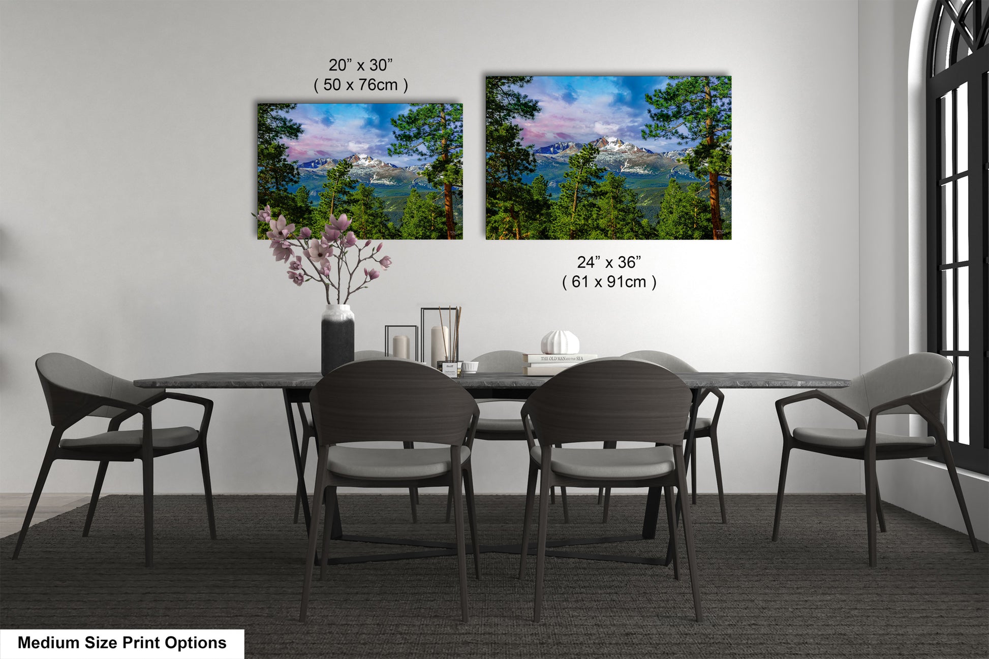 a dining table with four chairs and a vase of flowers