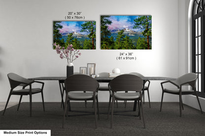 a dining table with four chairs and a vase of flowers