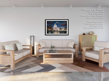a living room filled with furniture and a painting on the wall
