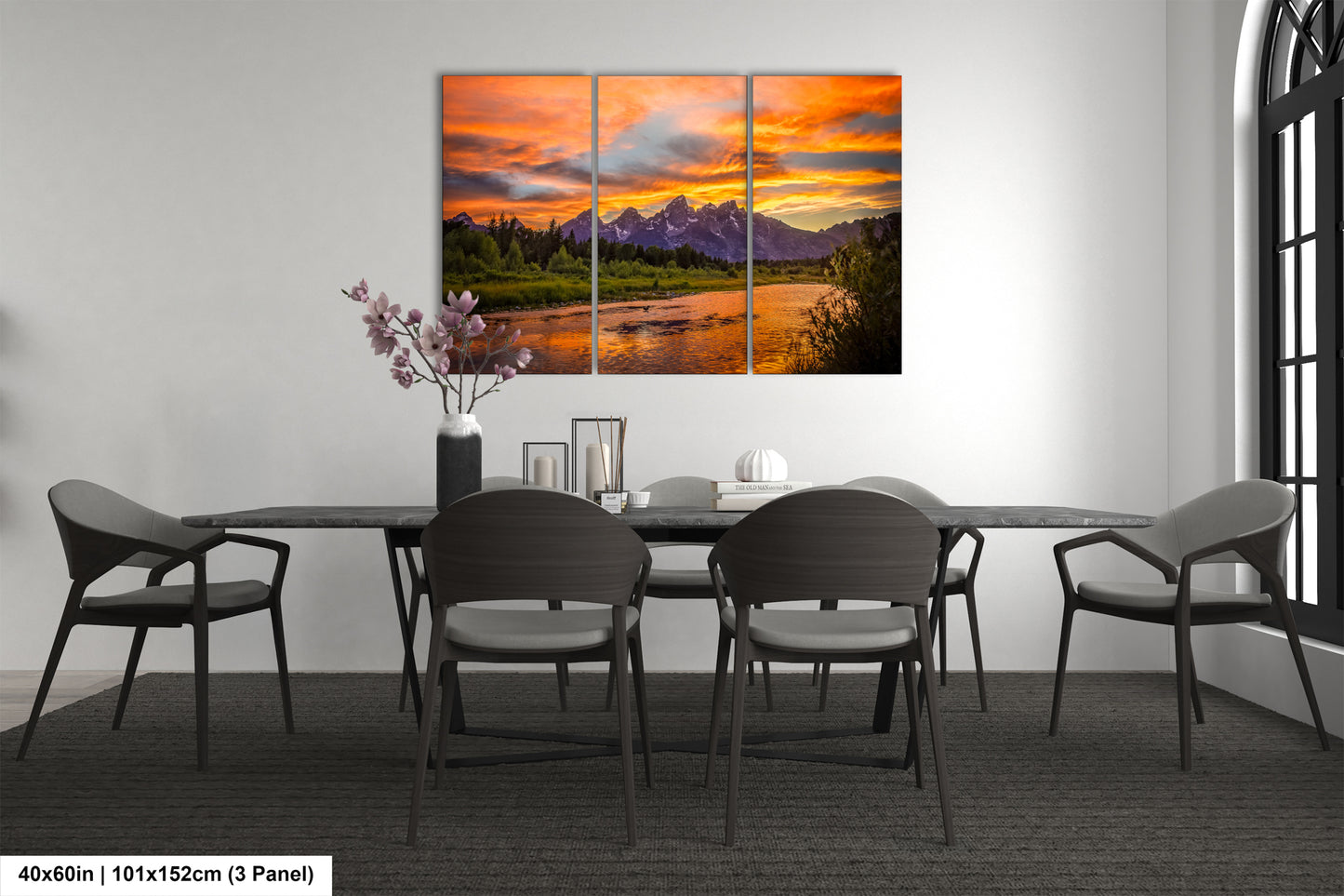 a dining room table with chairs and a painting on the wall