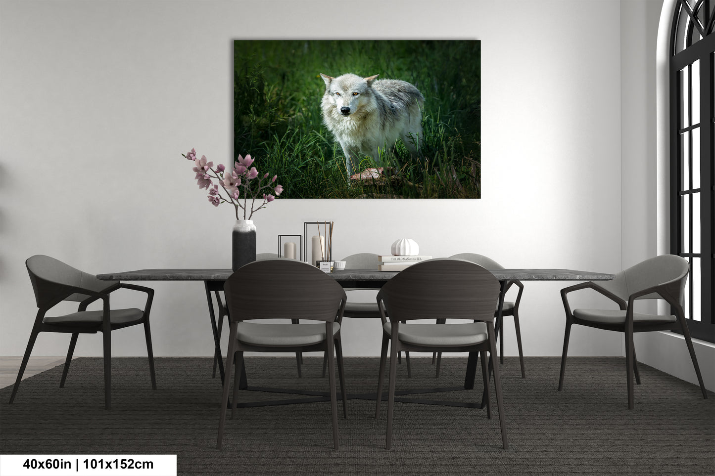 a dining room table with chairs and a picture of a wolf on the wall