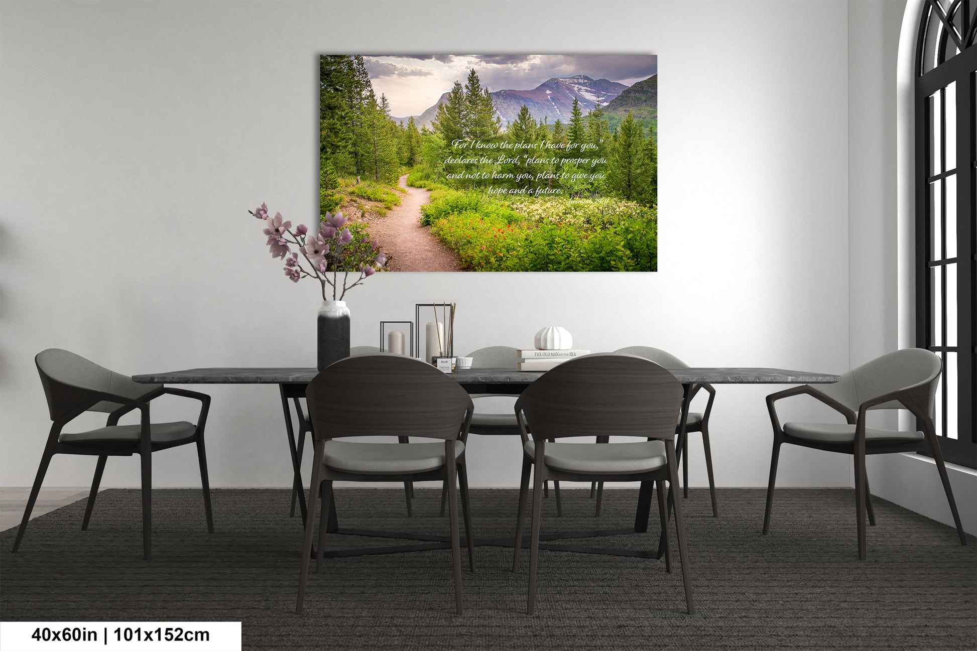 a room with a table and chairs and a painting on the wall