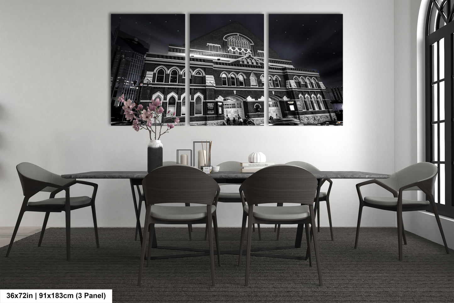 a black and white photo of a dining room